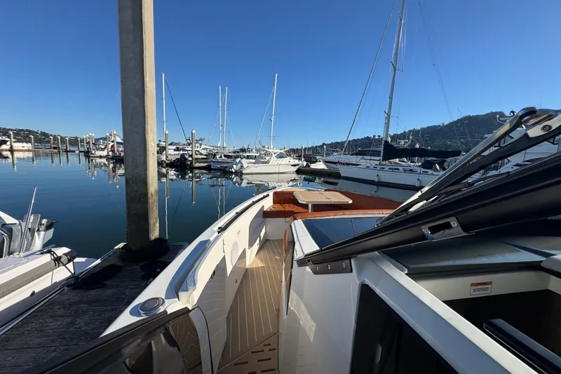 Slide: The Image of 2026 Saxdor 400 GTC docked at a marina with sailboats in the background. - 50