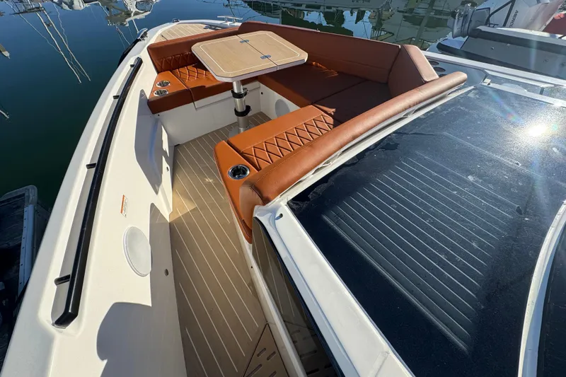 Slide: The Image of 2026 Saxdor 400 GTC boat with luxurious seating and table on deck. - 51
