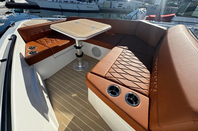 Slide: The Image of Luxurious seating area on the 2026 Saxdor 400 GTC boat with elegant brown upholstery. - 52