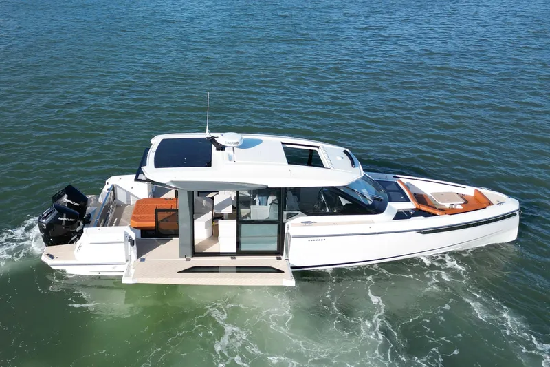 Slide: The Image of 2026 Saxdor 400 GTC luxury motorboat cruising on open water. - 6