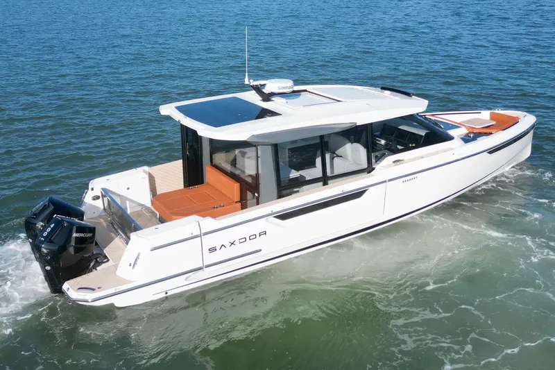 Slide: The Image of 2026 Saxdor 400 GTC luxury motorboat cruising on open water. - 8
