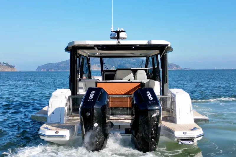 Slide: The Image of 2026 Saxdor 400 GTC boat with dual Mercury 400 V10 engines on open water. - 9