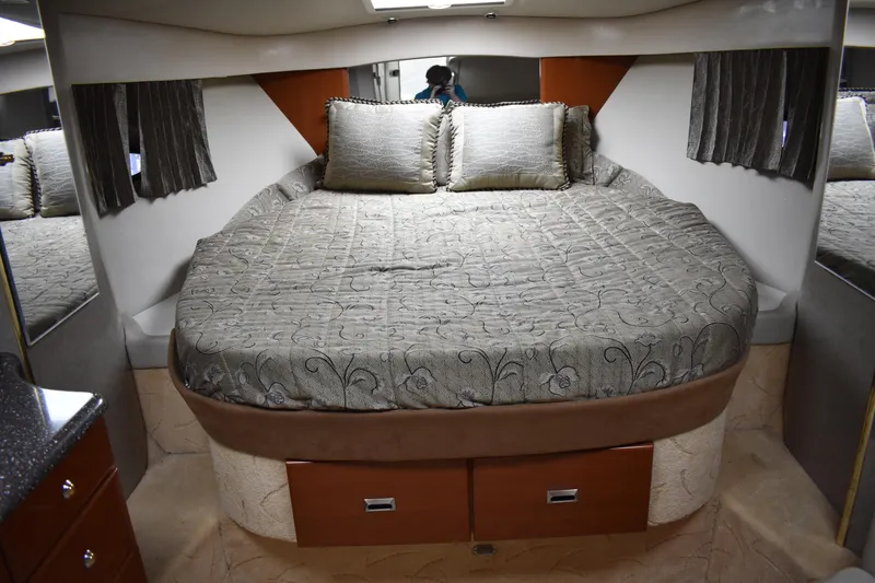 Slide: The Image of Luxurious bedroom in 2004 Formula 34 PC yacht with elegant bedding and storage drawers. - 10