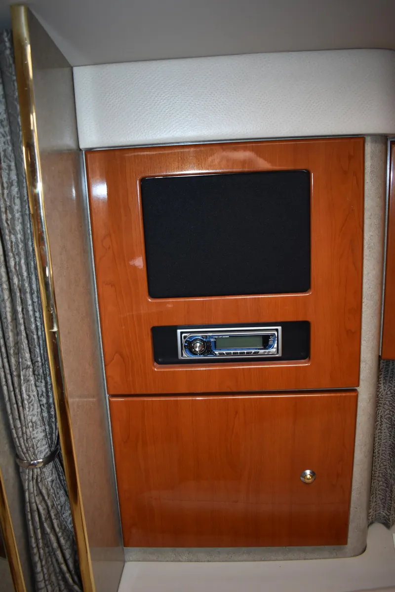 Slide: The Image of 2004 Formula 34 PC interior with wood paneling and built-in audio system. - 13