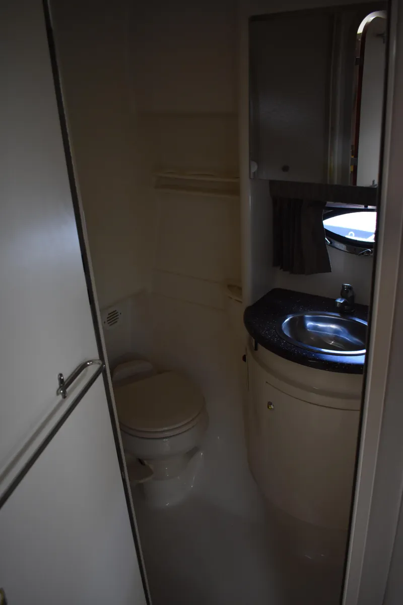 Slide: The Image of 2004 Formula 34 PC yacht bathroom with sink and toilet. - 14