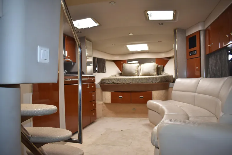 Slide: The Image of Interior of 2004 Formula 34 PC yacht with luxurious seating and cozy sleeping area. - 18