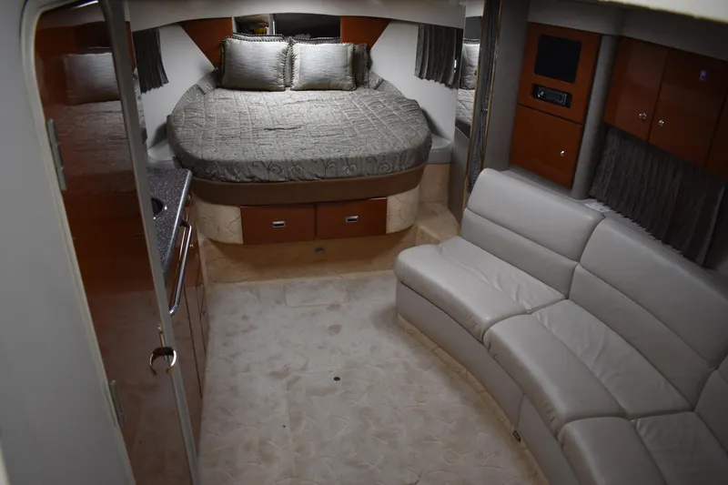 Slide: The Image of Luxurious interior of a 2004 Formula 34 PC yacht with bed and seating area. - 6