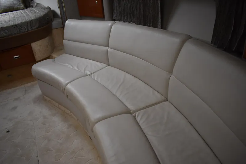Slide: The Image of 2004 Formula 34 PC yacht interior with curved beige leather seating. - 9
