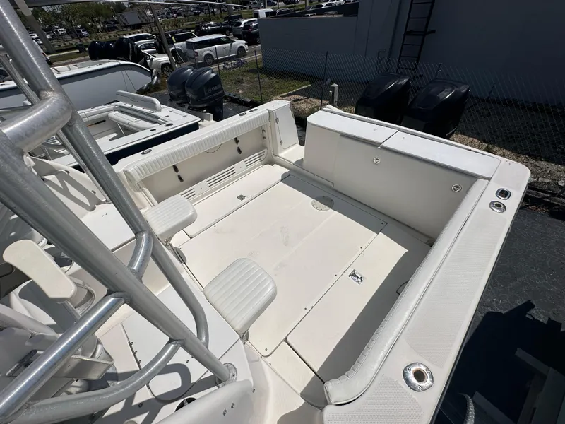 Slide: The Image of 1998 Trophy 2902 Walkaround boat deck with seating and storage compartments. - 3