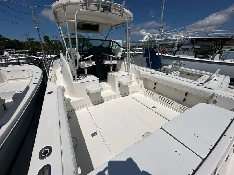 Slide: The Image of 1998 Trophy 2902 Walkaround boat with spacious deck and seating. - 5