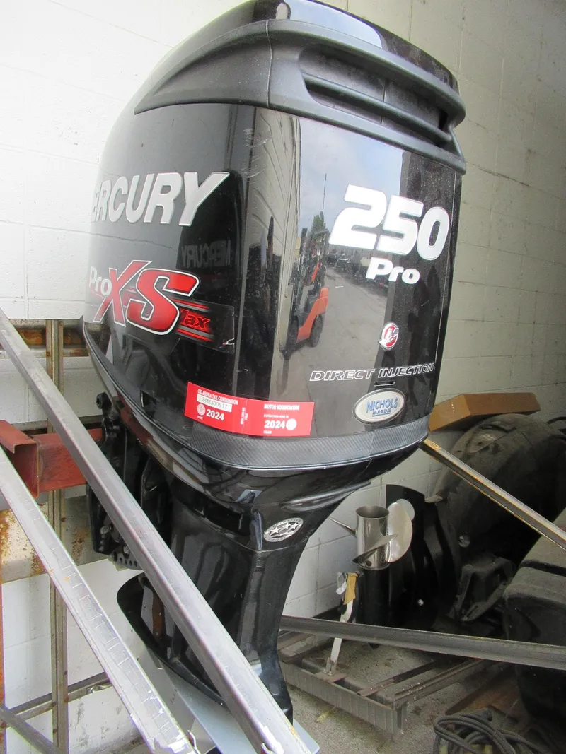 Slide: The Image of 2018 Mercury 250L PRO XS OPTI outboard motor in a workshop. - 2