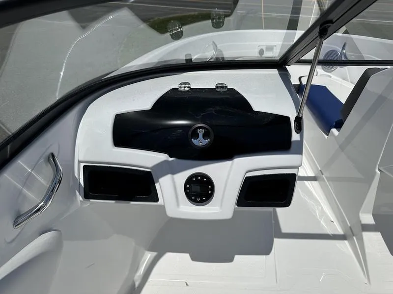 Slide: The Image of 2024 Tahoe 200 S boat dashboard with steering wheel and controls. - 1