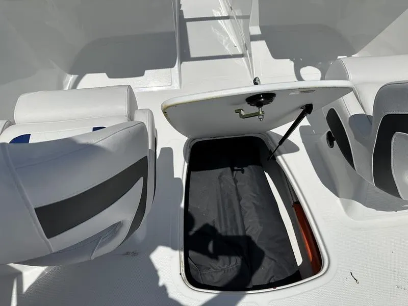 Slide: The Image of 2024 Tahoe 200 S boat interior with open storage compartment. - 6