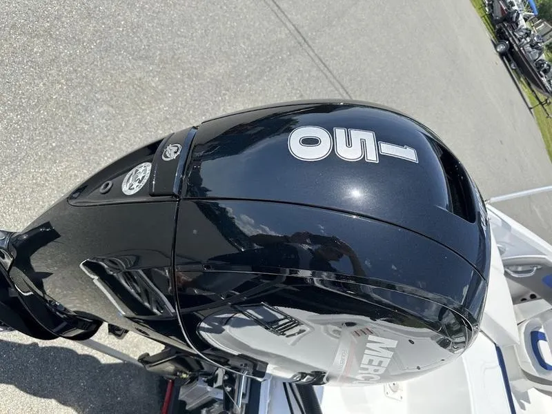 Slide: The Image of 2024 Tahoe 200 S boat with a 150 HP Mercury outboard motor. - 7