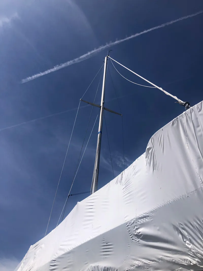 Slide: The Image of Mast of a 1974 Tartan 30 sailboat against a clear blue sky. - 22