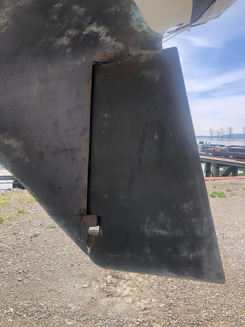 Slide: The Image of Rudder of a 1974 Tartan 30 sailboat on dry land. - 24