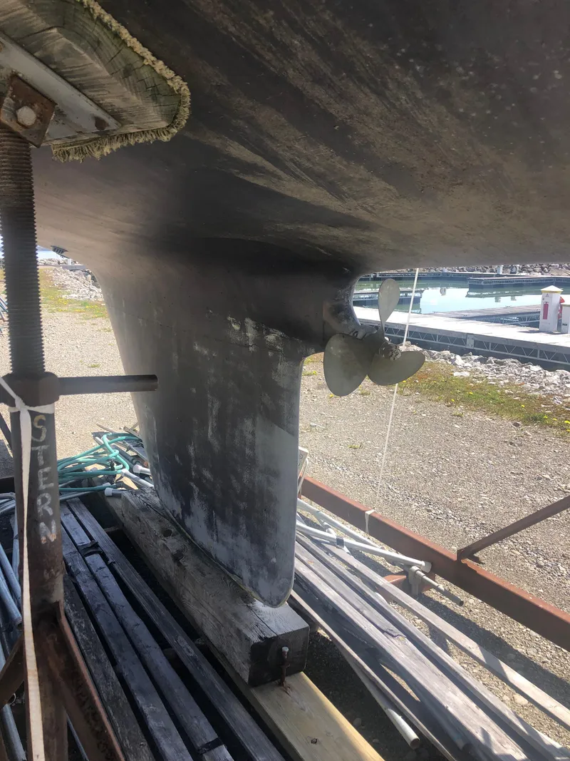 Slide: The Image of 1974 Tartan 30 sailboat keel and propeller on dry dock. - 25