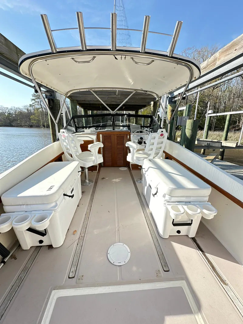 Slide: The Image of 1988 Albemarle 24 boat interior with seating and storage compartments. - 8