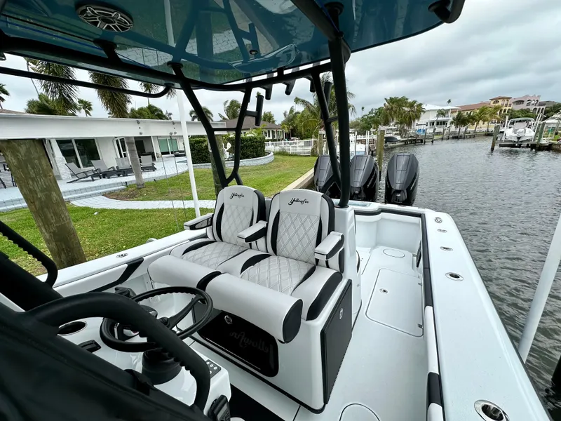 Slide: The Image of 2024 Yellowfin 36 boat interior with dual seats and steering console. - 10