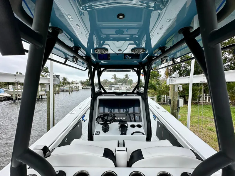 Slide: The Image of 2024 Yellowfin 36 boat cockpit with advanced navigation system and comfortable seating. - 12