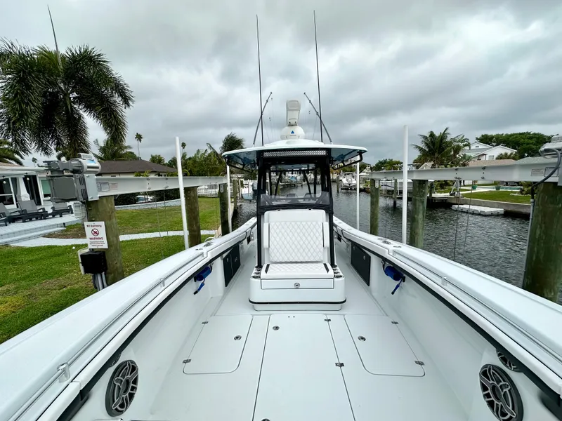 Slide: The Image of 2024 Yellowfin 36 boat docked, featuring spacious deck and modern design. - 17