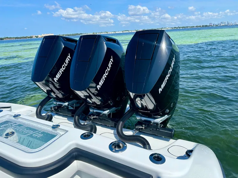 Slide: The Image of 2024 Yellowfin 36 boat with triple Mercury outboard engines on the water. - 3