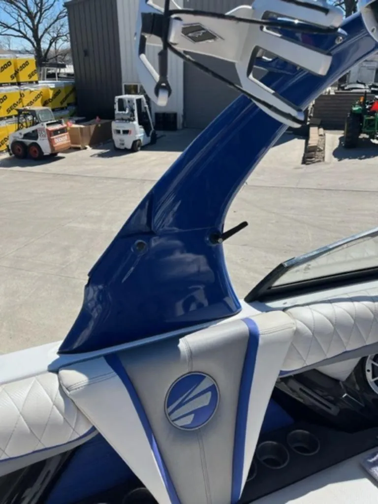 Slide: The Image of 2016 Tigé RZX boat interior with blue and white upholstery and wakeboard tower. - 11