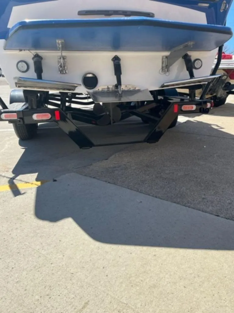 Slide: The Image of Rear view of a 2016 Tigé RZX boat on a trailer. - 5