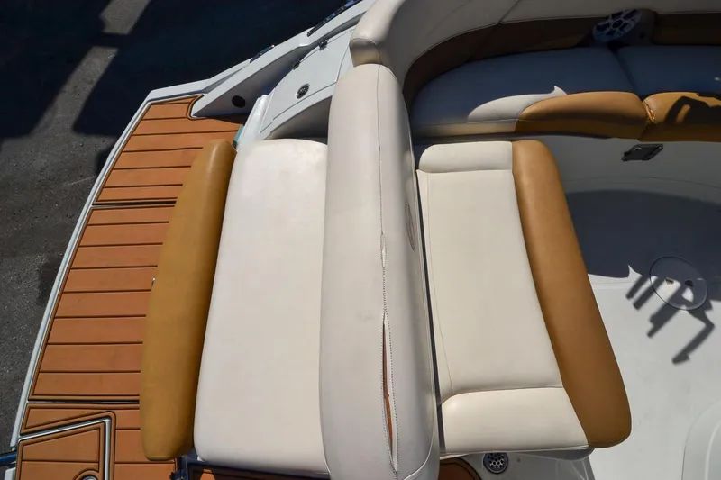 Slide: The Image of 2014 Crownline Eclipse E6 boat interior with tan and white seating. - 10
