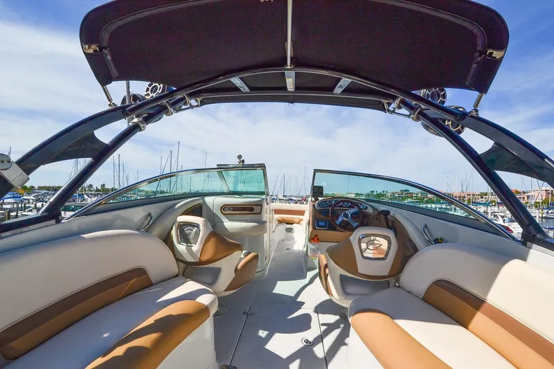 Slide: The Image of Interior of 2014 Crownline Eclipse E6 boat with tan and white seating. - 11