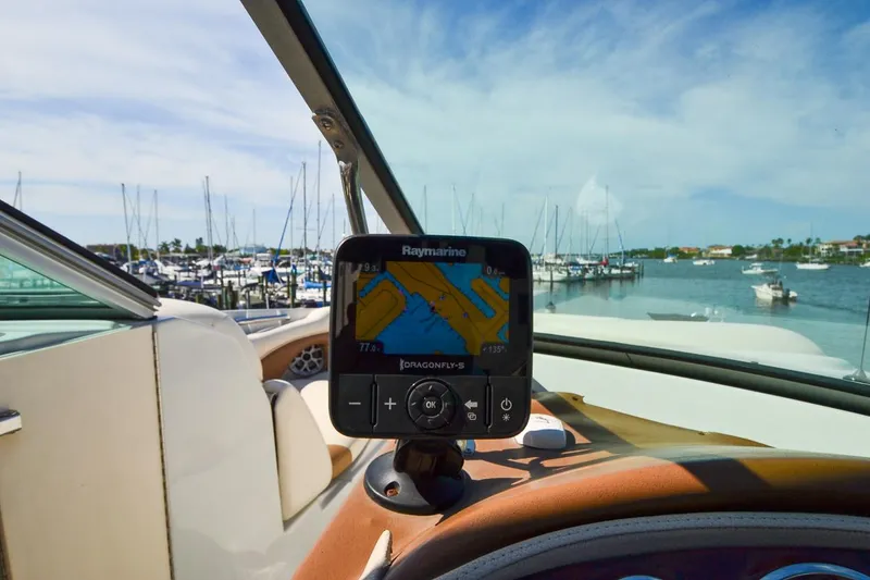 Slide: The Image of 2014 Crownline Eclipse E6 boat with Raymarine navigation system at marina. - 14