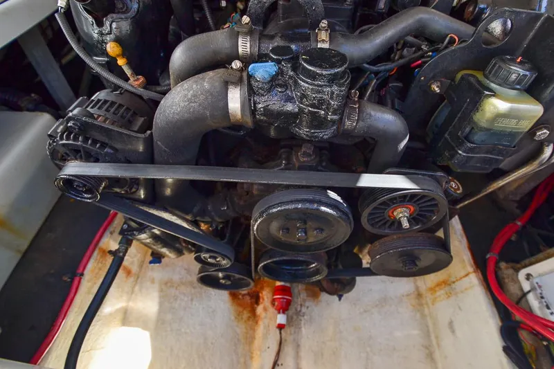 Slide: The Image of 2014 Crownline Eclipse E6 boat engine with visible belts and components. - 17