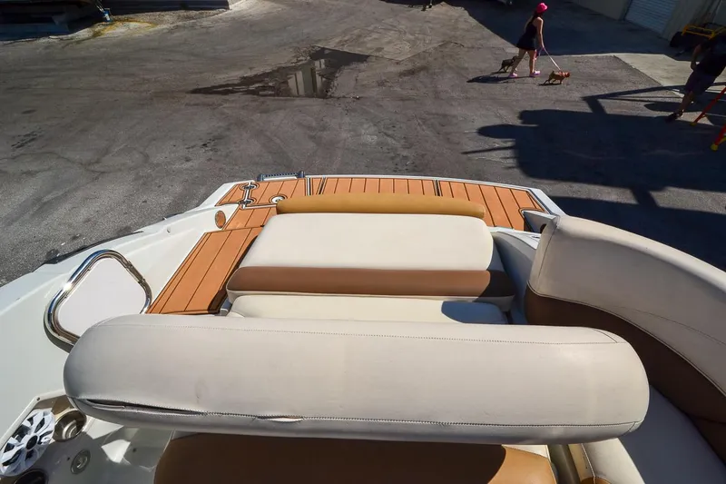 Slide: The Image of 2014 Crownline Eclipse E6 boat interior with cushioned seating and teak flooring. - 20