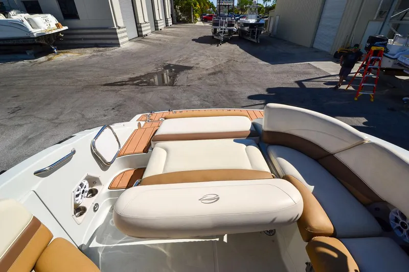 Slide: The Image of 2014 Crownline Eclipse E6 boat interior with tan and white seating. - 21