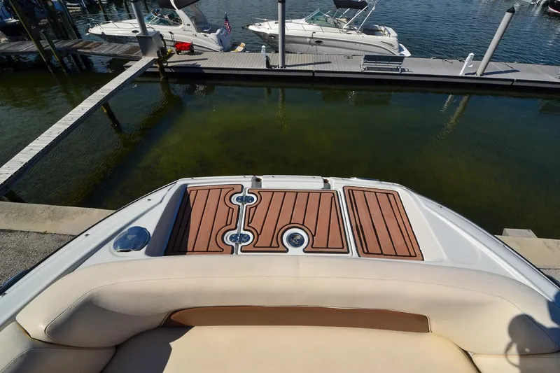 Slide: The Image of 2014 Crownline Eclipse E6 boat at dock with wooden deck. - 25