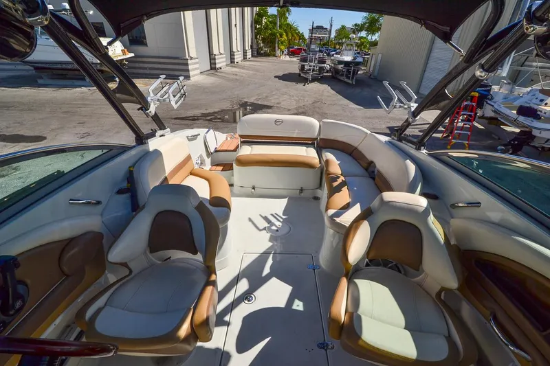 Slide: The Image of 2014 Crownline Eclipse E6 boat interior with tan and white seating. - 28