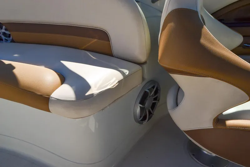 Slide: The Image of 2014 Crownline Eclipse E6 boat interior with tan and white seating. - 30