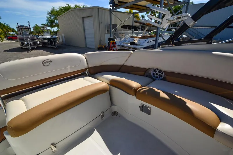 Slide: The Image of 2014 Crownline Eclipse E6 boat interior with tan and white seating. - 31