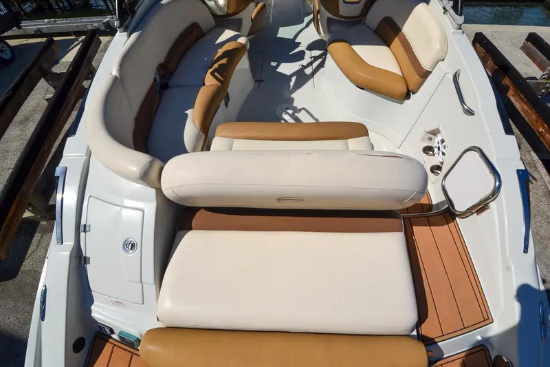 Slide: The Image of 2014 Crownline Eclipse E6 boat interior with tan and white seating. - 34