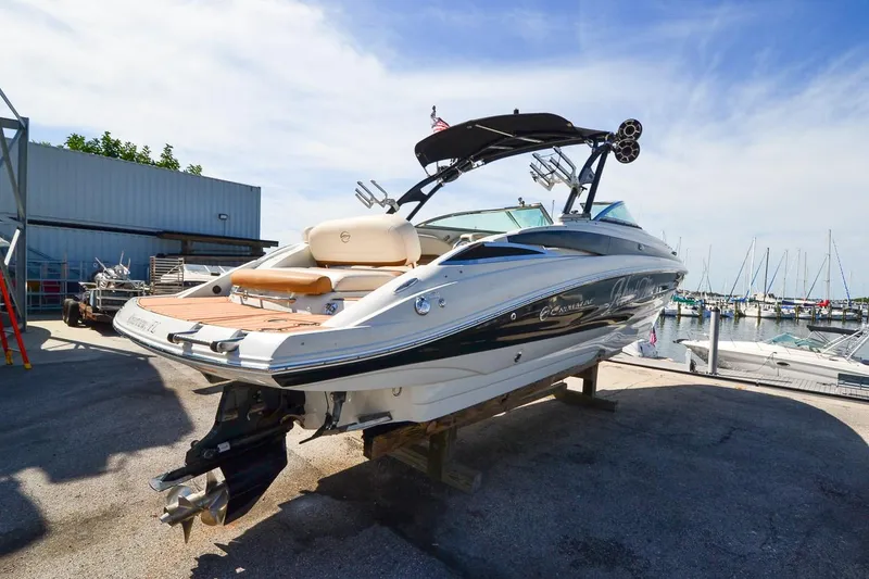 Slide: The Image of 2014 Crownline Eclipse E6 boat docked at a marina. - 5