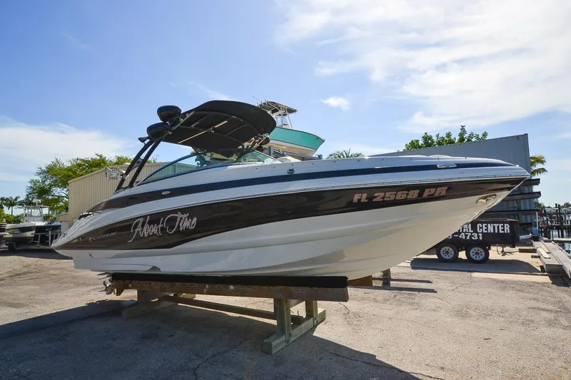 Slide: The Image of 2014 Crownline Eclipse E6 boat on a trailer in a marina. - 7