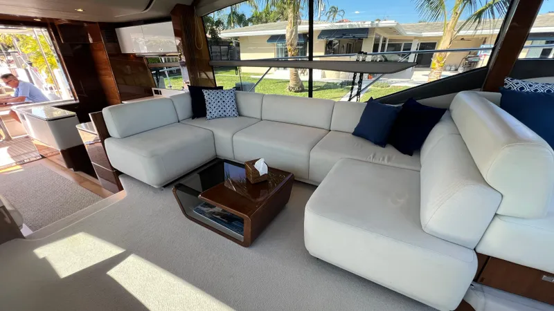 Slide: The Image of Luxurious interior of 2019 Princess F62 yacht with white seating and modern decor. - 13