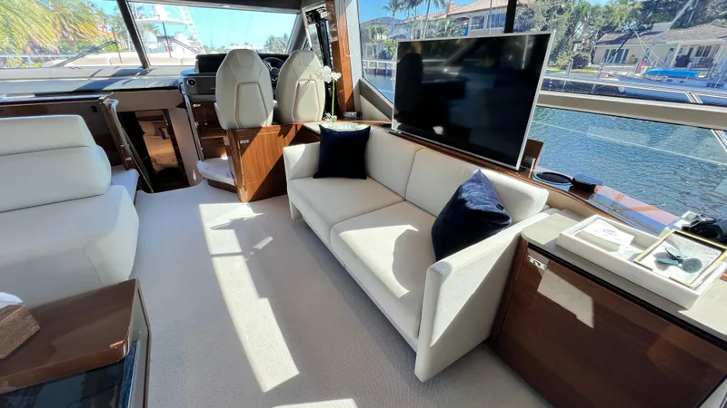 Slide: The Image of Luxurious interior of 2019 Princess F62 yacht with sofa and TV. - 14