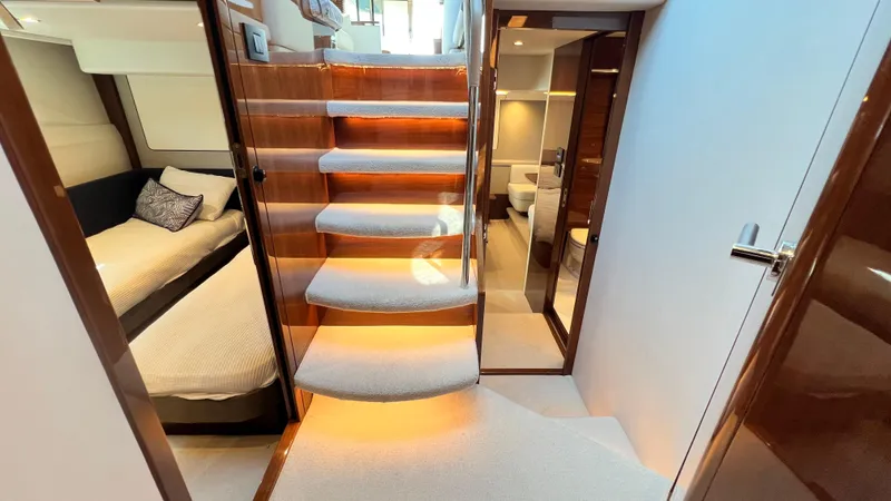 Slide: The Image of Luxurious interior of 2019 Princess F62 yacht with elegant staircase and cozy cabin. - 17