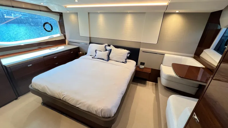 Slide: The Image of Luxurious bedroom interior of 2019 Princess F62 yacht with elegant furnishings. - 19