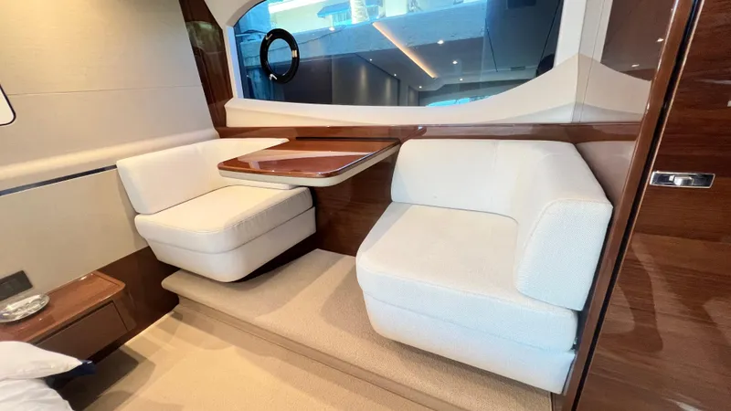 Slide: The Image of Luxurious interior of 2019 Princess F62 yacht with elegant seating and wooden accents. - 21