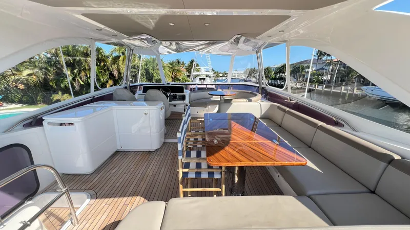 Slide: The Image of Luxurious 2019 Princess F62 yacht interior with spacious seating and elegant wooden table. - 29