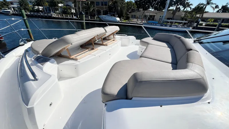 Slide: The Image of Luxurious seating on 2019 Princess F62 yacht deck, docked in a serene marina. - 38