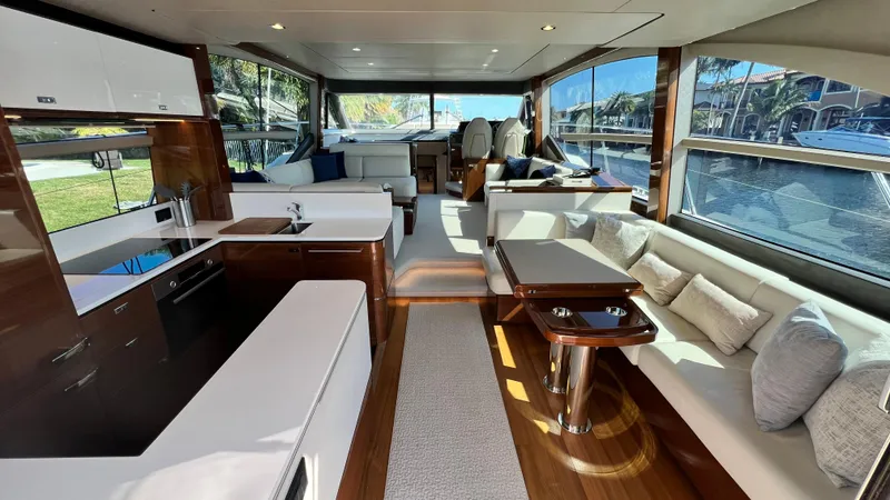 Slide: The Image of Luxurious interior of 2019 Princess F62 yacht with modern furnishings and large windows. - 4
