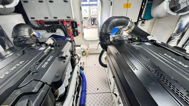 Slide: The Image of Engine room of a 2019 Princess F62 yacht, featuring dual D13-900 engines. - 44